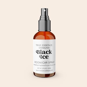 May include: A brown glass spray bottle with a black cap and a white label. The label reads "Black Ice ROOM|CAR SPRAY" in a stylized font. The bottle contains 2 fl oz of product.