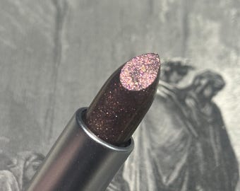 River Styx - Labial con brillo cobrizo translúcido