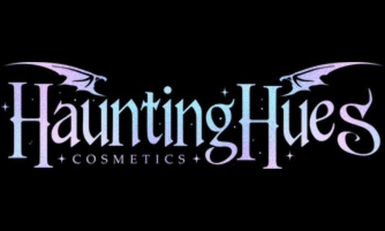 May include: A logo for a cosmetics company called "Haunting Hues Cosmetics". The logo features a gothic font with a gradient of purple and blue colors. The logo is framed by two stylized wings.