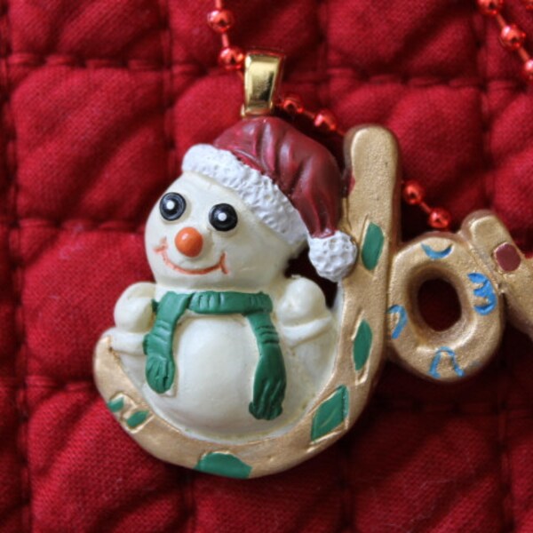 A Snowman With a Smile Sits on the "J" in Joy, Joy to the World, I 've got joy, joy down in my heart, Christmas gift, Secret Santa gift