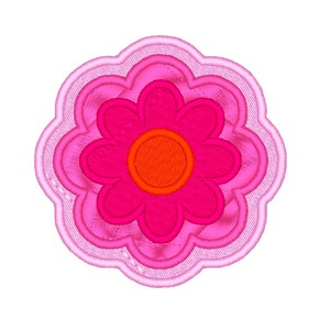 May include: A pink and red flower with a layered design. The flower has a large, round centre and eight petals.