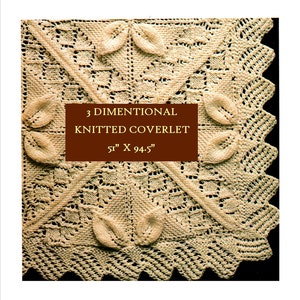 May include: A close-up of a beige knitted blanket with a 3-dimensional design. The blanket has a square shape with a border of leaves. The text "3 DIMENSIONAL KNITTED COVERLET 51" X 94.5" is printed on a brown rectangle in the center of the blanket.