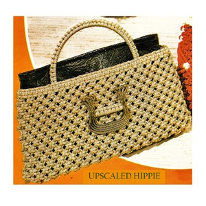 May include: A gold crocheted handbag with a black leather lining and a decorative clasp. The bag has a woven texture and a large, open top. The text "UPSCALED HIPPIE" is printed below the bag.