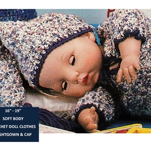 May include: Crocheted doll clothes for a 16-19 inch soft body doll. The set includes a purple and white nightgown and a matching cap.