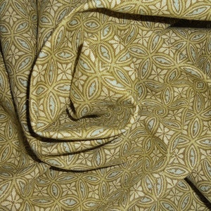 May include: Close-up of a fabric with a repeating pattern of stylized flowers in shades of green and beige.