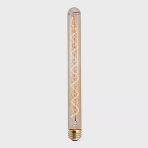 May include: A long, tubular light bulb with a clear glass enclosure. The bulb features a warm, amber-colored filament in a spiral design. The base is gold-colored. The overall design is vintage-inspired.