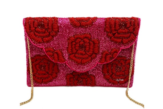 Female red purse with roses flowers. Stylish suede burgundy handbag.  Valentine's day present, Women's day. Fashion Stock Photo - Alamy