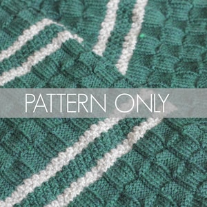 May include: A close-up of a green and white knitted scarf with a textured pattern. The scarf has two white stripes running down the length of the scarf. The text "PATTERN ONLY" is visible in the image.