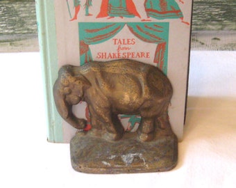Antique bronze elephant bookend, gold metal brass alloy, single heavy bookend door stop, early 1900s 10s 20s 30s African mammal animal
