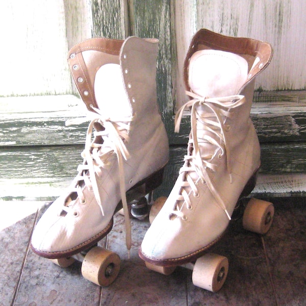 Antique white leather roller skates, wood soles wheels, mid century 50s 60s