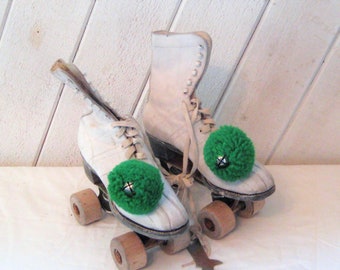 Antique white leather roller skates, wood wheels, size 4, rustic distressed skates, green pompom with bell, lace up, mid century, 40s 50s