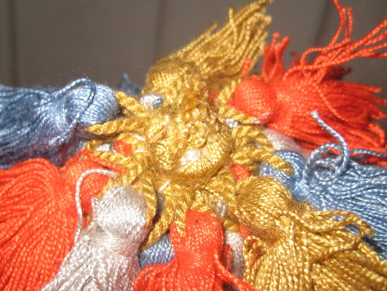 vintage orange old clock key gold tassel blue gray Skeleton key on ornate tassle antique