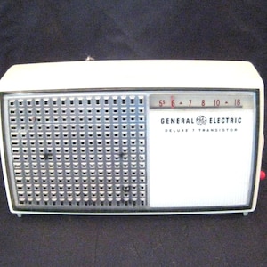 Vintage AM transistor radio, General Electric small portable traveling radio, movie prop display item non working MCM mid century petite