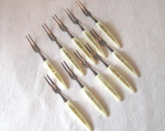 Vintage collection of 9 hors d oeuvre small forks, pickle olive accent decorative toothpick forks, ivory plastic handles stainless steel