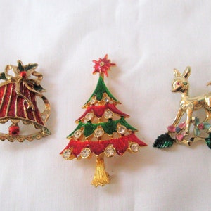 Collection of three Christmas brooches, enamel red bell, gold tone deer, red green Christmas tree, vintage holiday lapel pin, gift for her