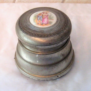 Round alumunim powder music box, metal ring trinket box, Victorian couple, footed, antique ornate music box, Thorens