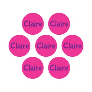 May include: Seven pink circles with the name "Claire" written in purple on each circle.