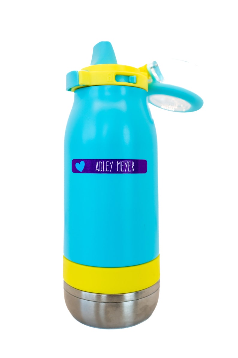 May include: A blue and yellow water bottle with a stainless steel bottom. The bottle has a heart and the name "ADLEY MEYER" on a purple label.