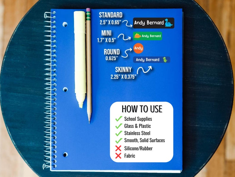 May include: A blue notebook with a white spiral binding. The notebook has a white and yellow pencil and a white marker on top of it. The notebook has text that says "STANDARD 2.5" X 0.65" MINI 1.7" X 0.5" ROUND 0.625" SKINNY 2.25" X 0.375" HOW TO USE School Supplies Glass & Plastic Stainless Steel Smooth, Solid Surfaces Silicone/Rubber Fabric".