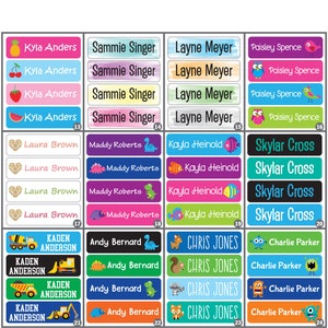 May include: A set of 24 colorful name labels with various designs. The labels feature names like Kyla Anders, Sammie Singer, Layne Meyer, Paisley Spence, Laura Brown, Maddy Roberts, Kayla Heinold, Skylar Cross, Kaden Anderson, Andy Bernard, Chris Jones, and Charlie Parker.