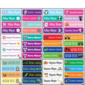 May include: A set of 40 colorful personalized name labels with various animal and vehicle illustrations. The labels feature names like Adley Meyer, Katie Lincoln, Kayson Meyer, and Cristian A. Mendez. The labels are perfect for school supplies, lunchboxes, and other personal items.