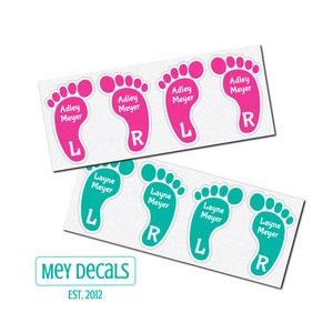 May include: Two sets of personalized foot-shaped stickers with the names Adley Meyer and Layne Meyer, each with a left and right foot labeled with an L and R. The stickers are pink and teal.