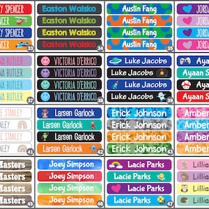 May include: Four rows of colorful name labels with different designs. Each label has a name printed in white letters and is repeated four times. The designs include rainbows, hearts, smiley faces, video game controllers, rockets, and camouflage patterns.