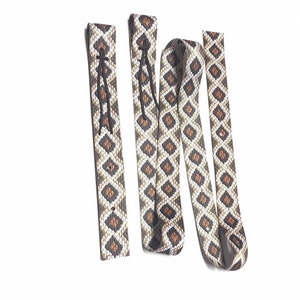 Brown cinch ,  colored cinch strap, horse tack, patterned cinch, rattlesnake cinch, latigo, cinch set