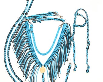 May include: A blue and black braided horse halter with fringe and matching reins. The halter has a round metal buckle.