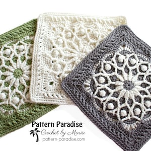 May include: Three square crochet pieces in shades of green, white, and gray. Each piece features a detailed, floral-like pattern in the center, surrounded by a textured border. The pieces are likely handmade and showcase intricate stitch work.