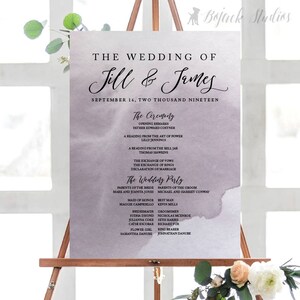 May include: A wedding ceremony program with a watercolor background in shades of gray and purple. The program lists the names of the bride and groom, Jill and James, and the wedding date, September 16, 2019. It also includes the names of the wedding party members.