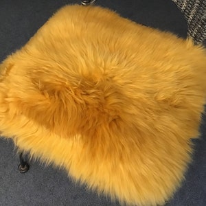 seat cover / pad made out of natural lambskin / sheepskin colour "yellow ocher" 42cm x 42cm