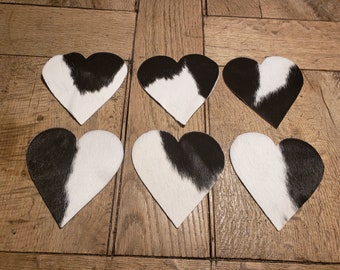 6 coasters made of cowhide in the shape of a heart, black/white spotted approx. 12.5 cm x 13 cm