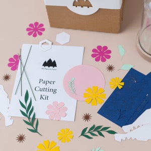 paper peieces to do a paper cutting craft kit. this is a kit by my papercut forest