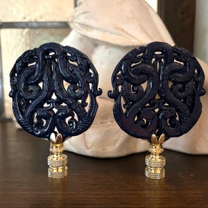 A Pair Of Chinoiserie Navy Blue Lamp Finials