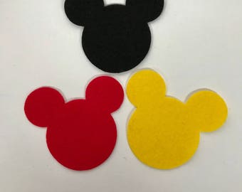 May include: Three felt Mickey Mouse head shapes in black, red and yellow.