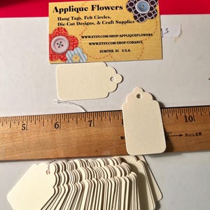 100 ct small scalloped top tags in Cream Manila