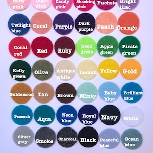 May include: A color chart with 36 different colors of felt circles. The colors are arranged in rows and columns. The colors include baby pink, light pink, candy pink, shocking pink, fuchsia, bright lilac, twilight blue, coral, purple, dark purple, peach, orange, coral red, red, ruby, neon green, apple green, pirate green, kelly green, olive, antique white, lemon, yellow, gold, goldenrod, tan, brown, minty, baby blue, brilliant blue, peacock, aqua, neon blue, royal blue, navy, white, silver gray, smoke, charcoal, black, peaceful blue, and ocean blue.