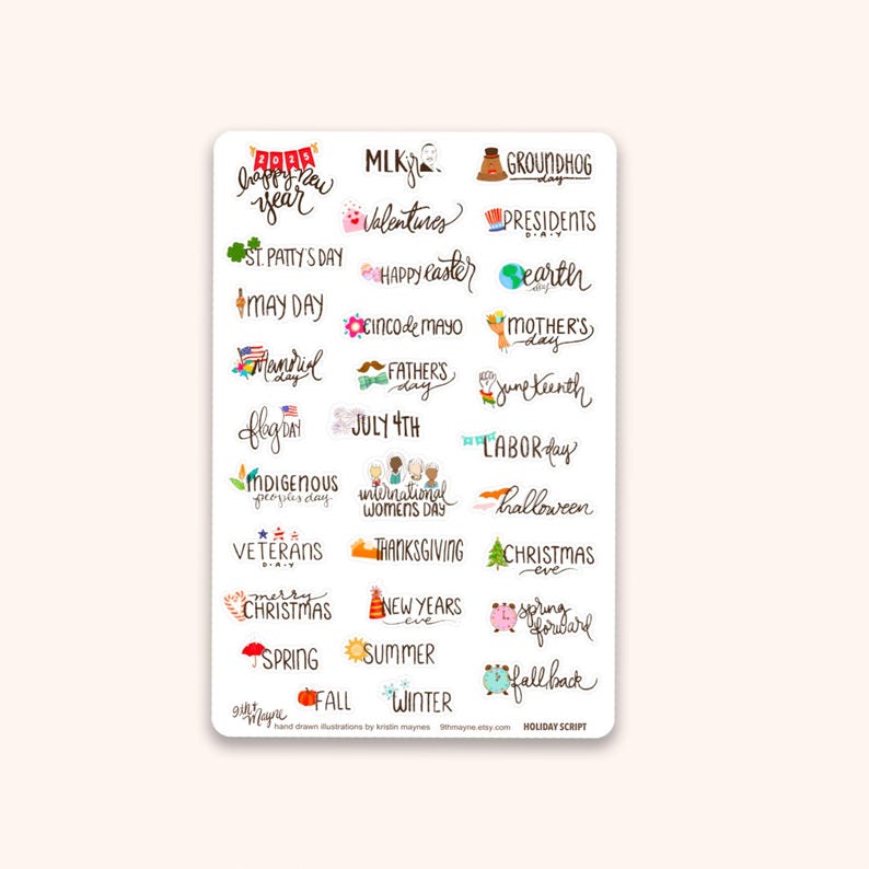 May include: A white sticker sheet featuring handwritten holiday-themed text. Includes phrases like "Happy New Year," "Valentine's," "St. Patrick's Day," "Mother's Day," and "Christmas." The sticker sheet is perfect for planners and scrapbooking.