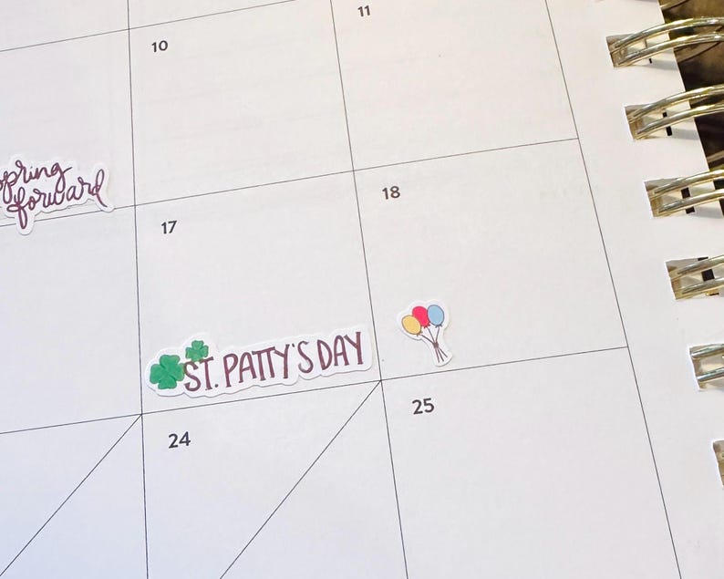 May include: A white calendar page with stickers. One sticker says "spring forward" in cursive. Another says "St. Patty's Day" with a green shamrock. A third sticker shows a bunch of balloons.