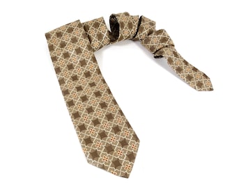 May include: A brown patterned tie with a geometric design featuring white and orange accents.