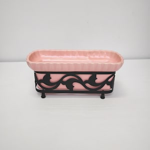 May include: A set of three ceramic mugs with a speckled, matte finish. The mugs are in shades of cream, light grey, and dark grey. Each mug has a simple, minimalist design, ideal for coffee or tea.