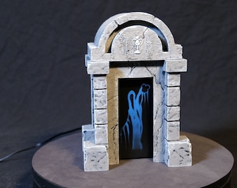May include: A gray stone archway with a blue and white ghostly figure inside. The archway has a small, carved design above the door.