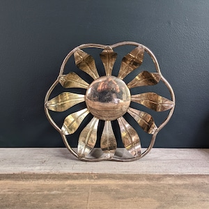 vintage silver plate bowl with cut out leaf shapes.  natural patina left on the silver for a mottled look.