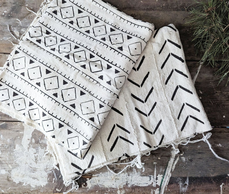 white thick cotton fabric with hand printed black slashes or geometric triangles