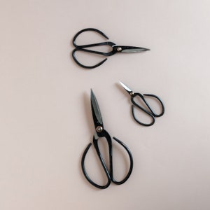 forged iron garden shears with extra large, black iron curved handles.  extra space for comfort when wearing gloves.  extra sharp point. available in 4, 6 or 8 inches