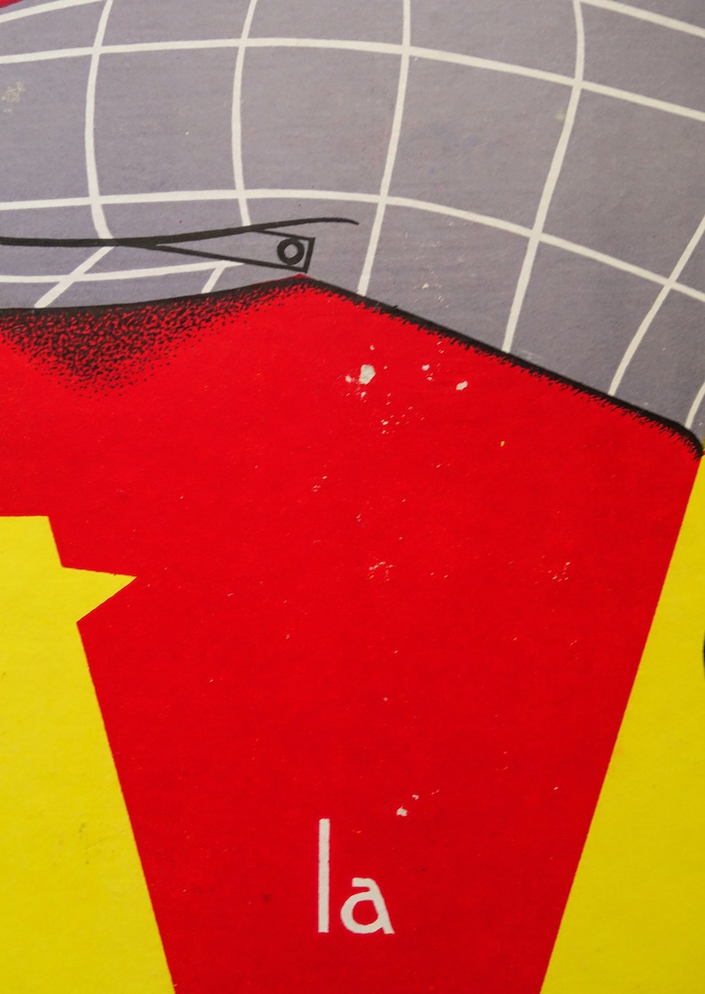 May include: A red and yellow poster with the word "la" printed in white. The poster has a gray and white grid pattern in the upper left corner.