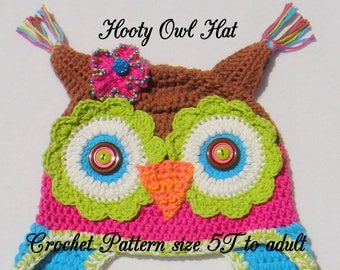 May include: A crocheted owl hat with pink, green, blue, and brown yarn. The hat has a flower on top and two long braided ties. The hat is labeled "Hooty Owl Hat" and "Crochet Pattern size 5T to adult".