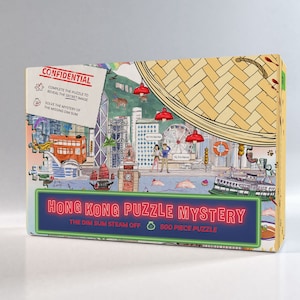 Könnte beinhalten: Ein 500-teiliges Puzzle mit einer farbenfrohen Illustration von Hongkong mit dem Text "Hong Kong Puzzle Mystery: The Dim Sum Steam Off".