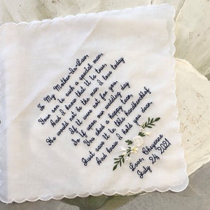 May include: White embroidered handkerchief with a handwritten message to a mother-in-law. The message reads "To My Mother-In-Law, Your son is such a special man, And I know that it is true, He would not be the man I love today If it were not for you. So if upon our wedding day You shed a happy tear, Do save it in this handkerchief And know I hold you dear. Love, Cheyenne July 24, 2021".